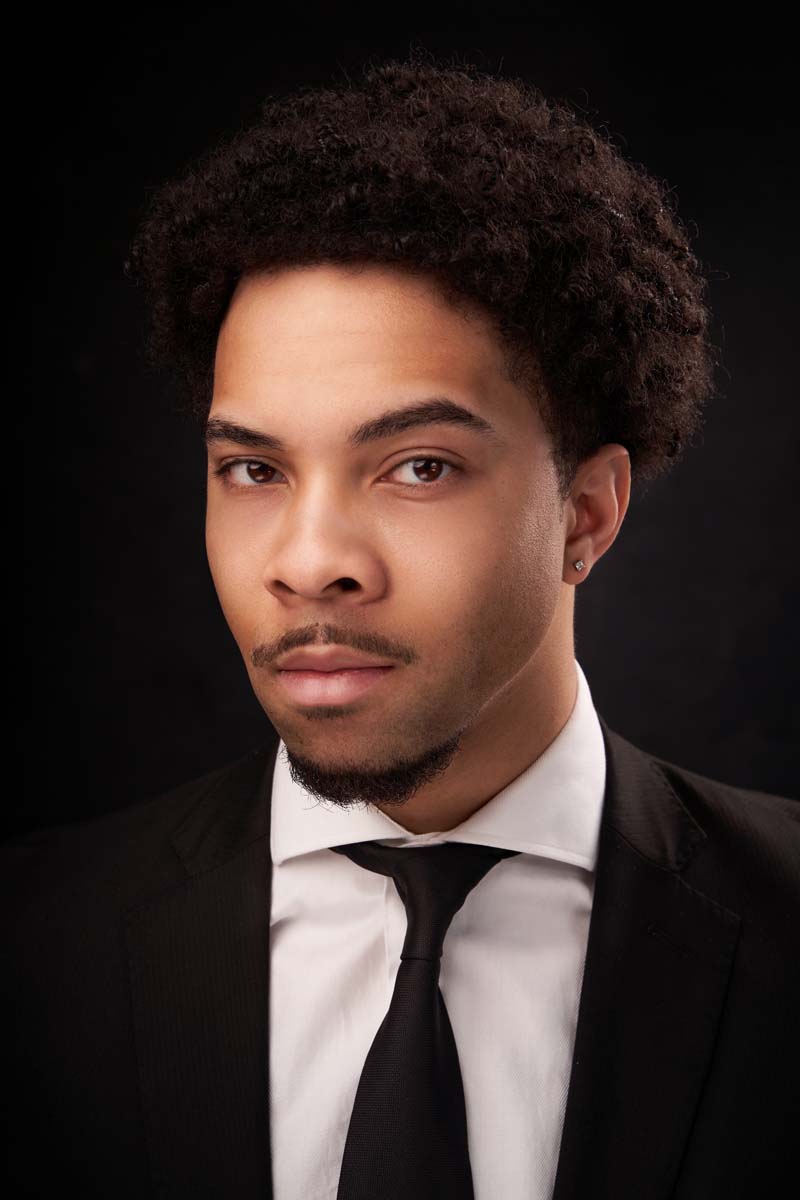 Man black suit professional headshot NYC