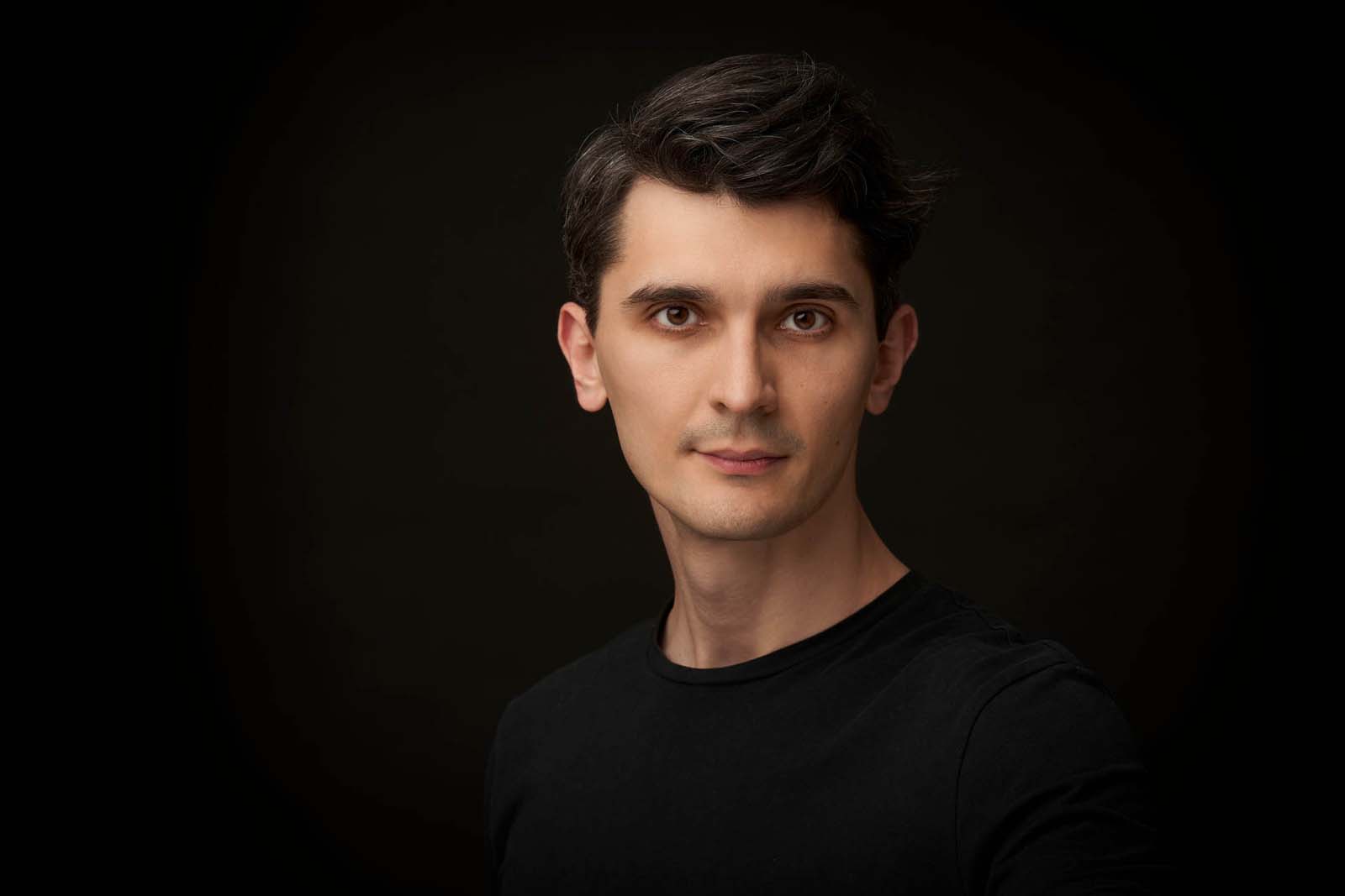 Man casual business headshot dark background NYC