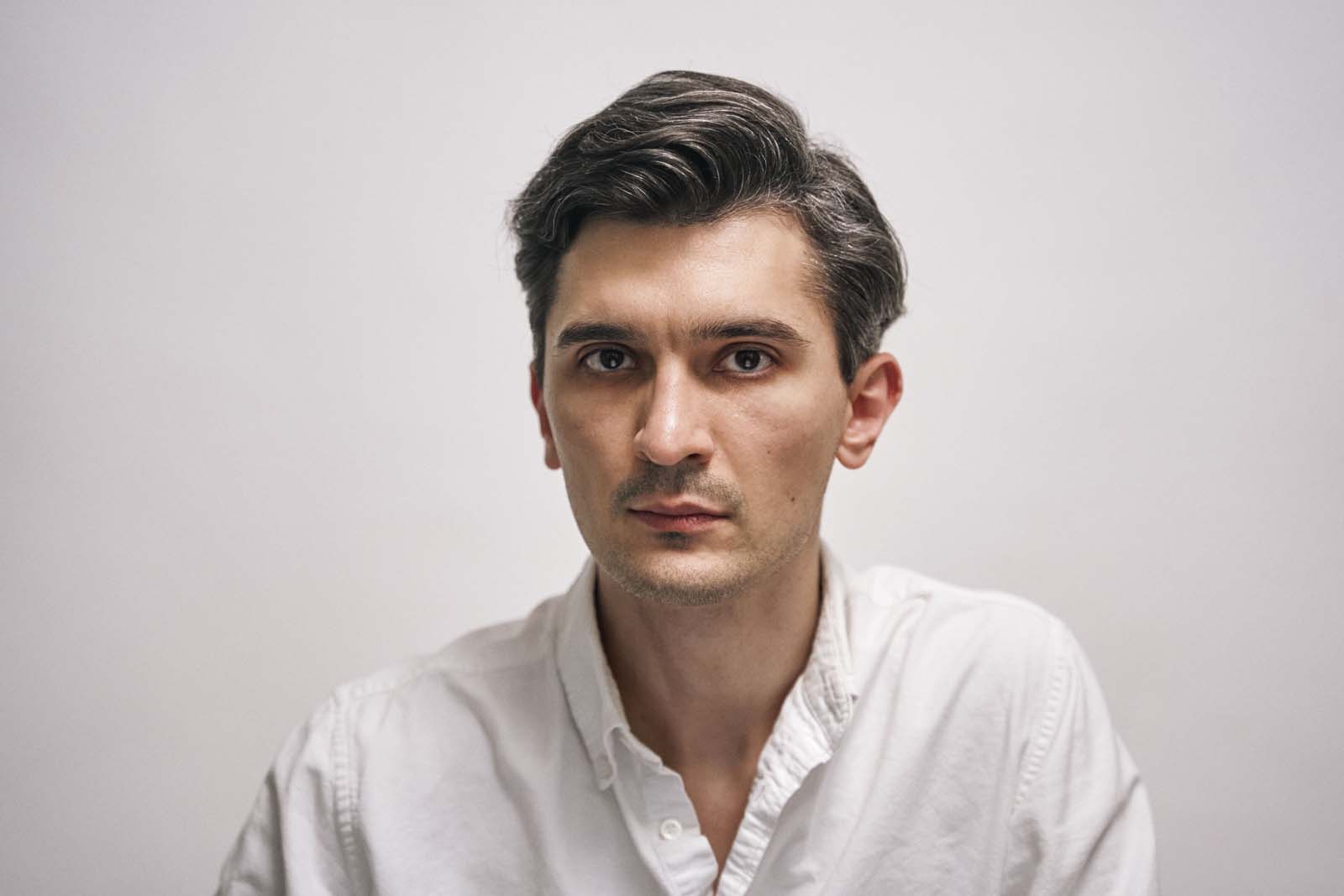 Man professional headshot neutral background NYC