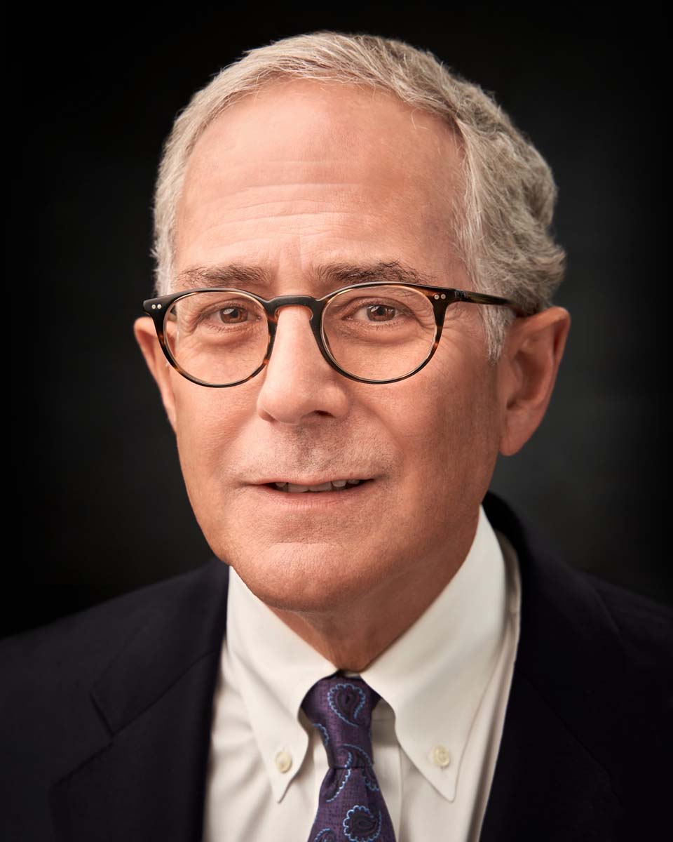 Senior businessman glasses professional headshot NYC