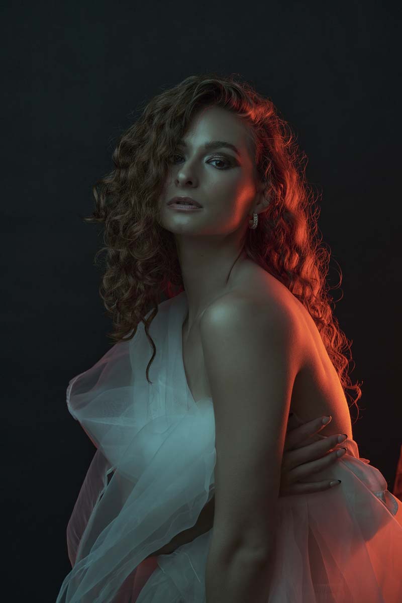 Woman curly hair colored lighting fashion fine art NYC