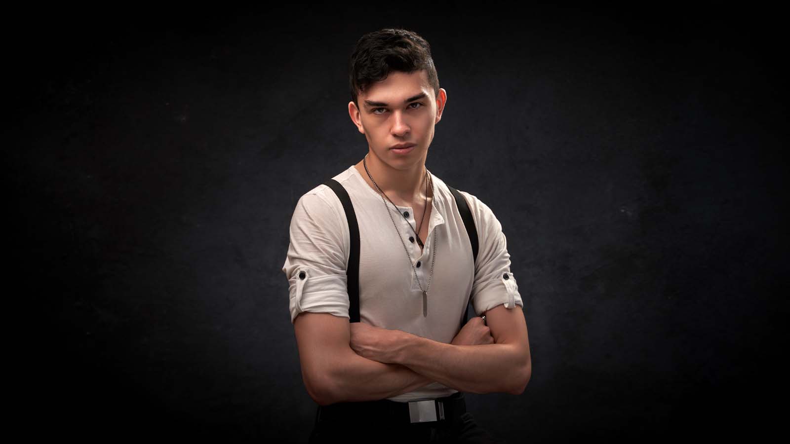 Young man suspenders editorial portrait NYC