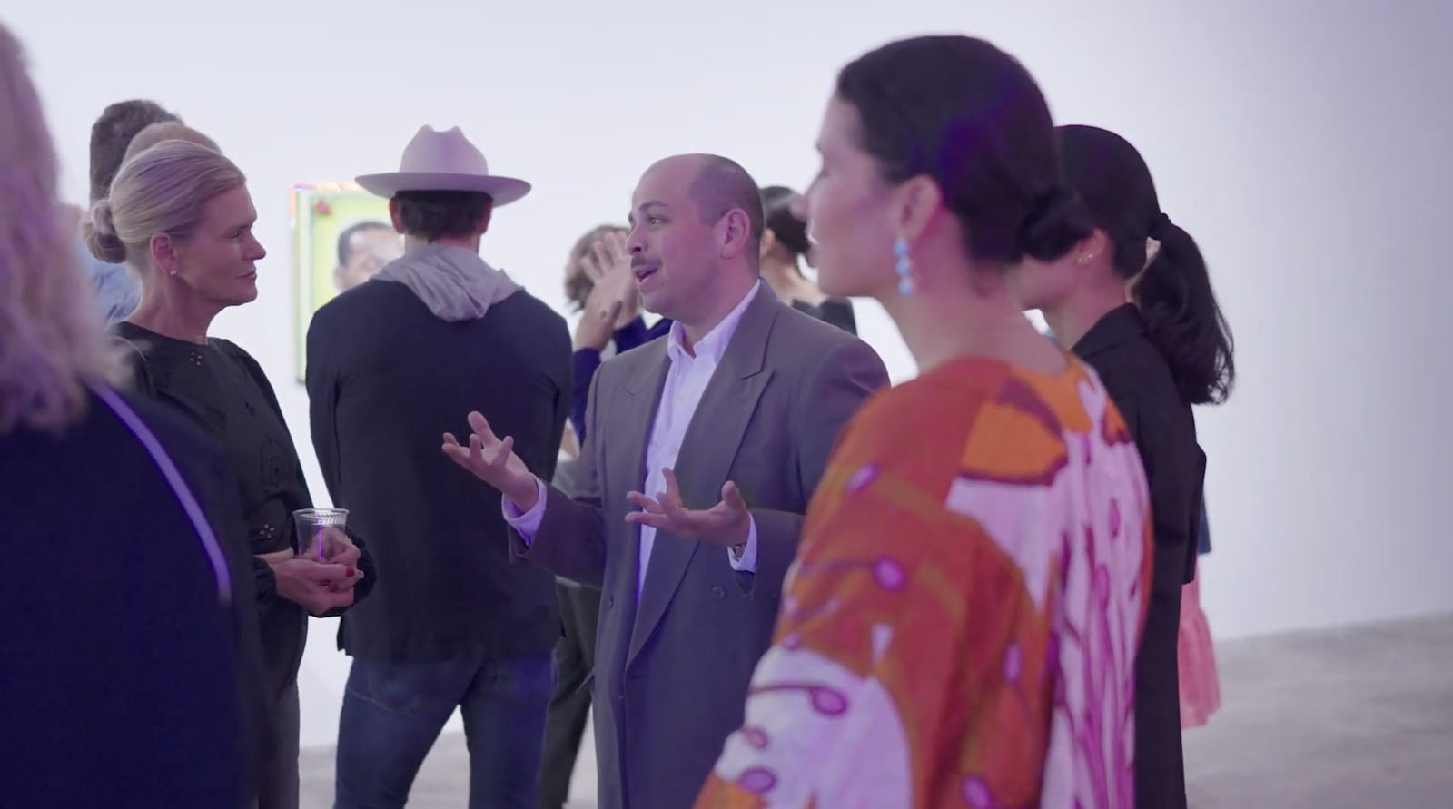 Networking at NYC art gallery event social conversation photography